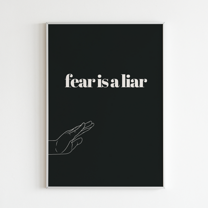 Poster Fear is a liar inramad mot vit vägg