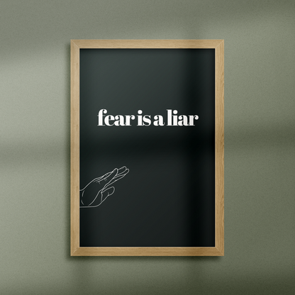 Poster Fear is a Liar inramad mot grön vägg