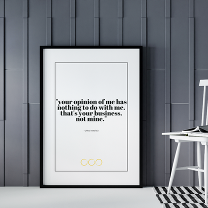 Poster Your opinion inramad lutad mot grå vägg, vit stol syns till höger