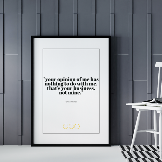 Poster Your opinion inramad lutad mot grå vägg, vit stol syns till höger